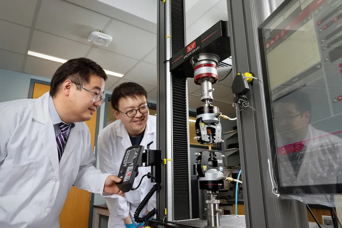 Students using laboratory equipment.